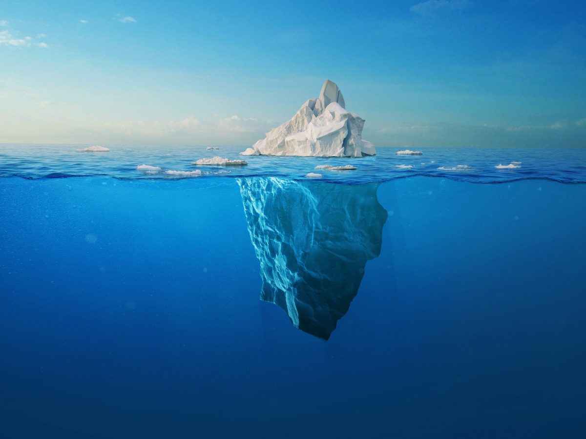 Amazing,White,Iceberg,Floats,In,The,Ocean,With,A,View